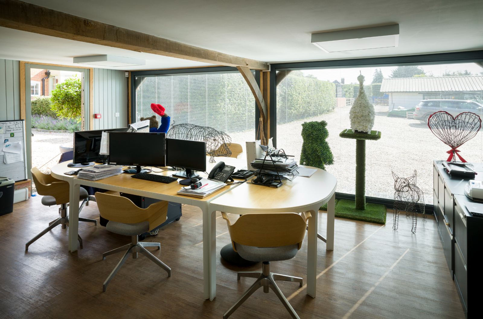The Banks Landscapes studio, drawing boards and topiary frames by the window